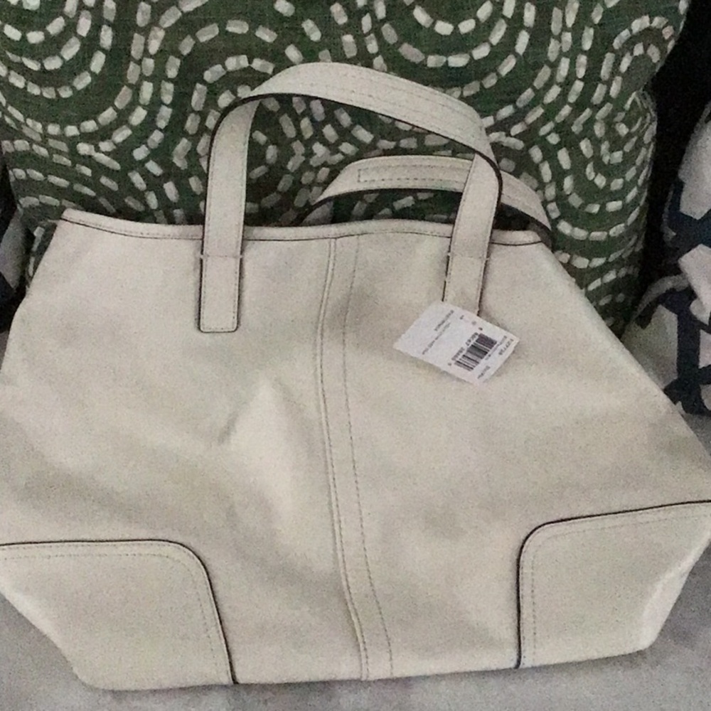 A signature cream leather coach tote